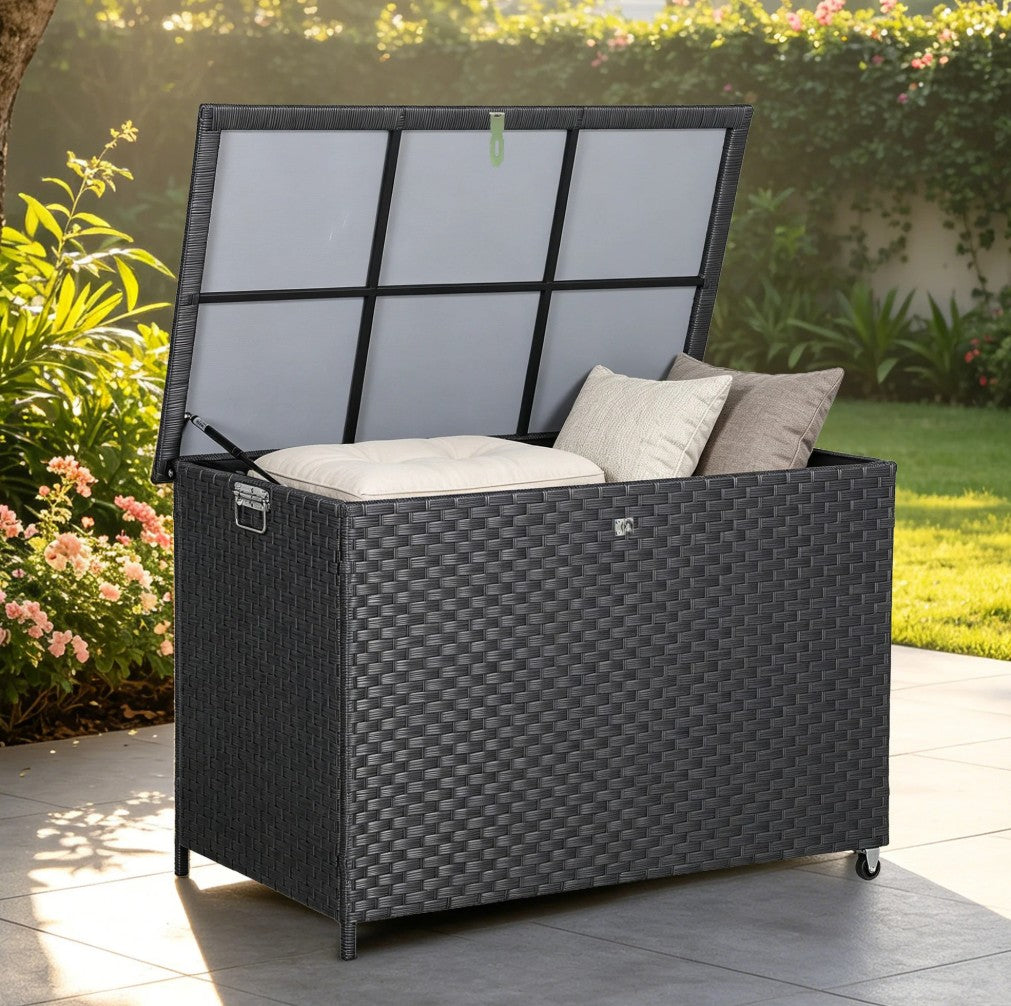 Large black polyrattan garden storage box 480L set on a modern patio